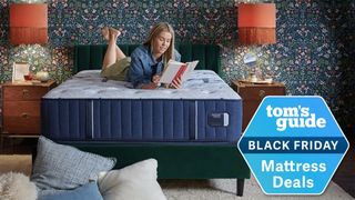A woman lying on a Stearns & Foster Estate mattress while reading a book, with a Tom's Guide Black Friday Mattress Deals badge overlaid