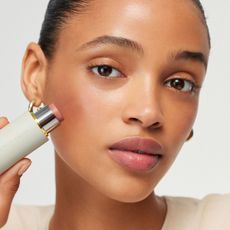 Model holding Westman Atelier Baby Cheeks