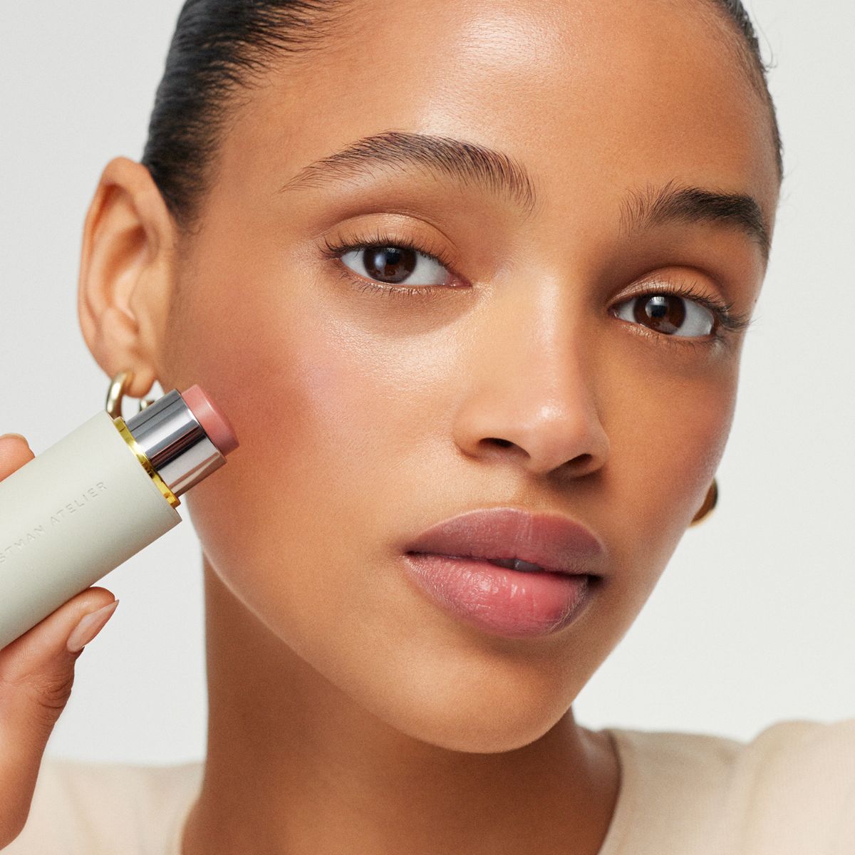 Model holding Westman Atelier Baby Cheeks