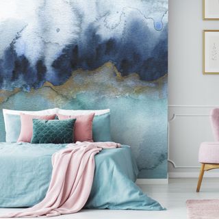 bedroom wall decor ideas, bedroom with wall mural, aqua bedding with pink cushions and throw, pink armchair to side
