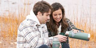 Greg and Katie sharing a drink from a thermos The Bachelorette