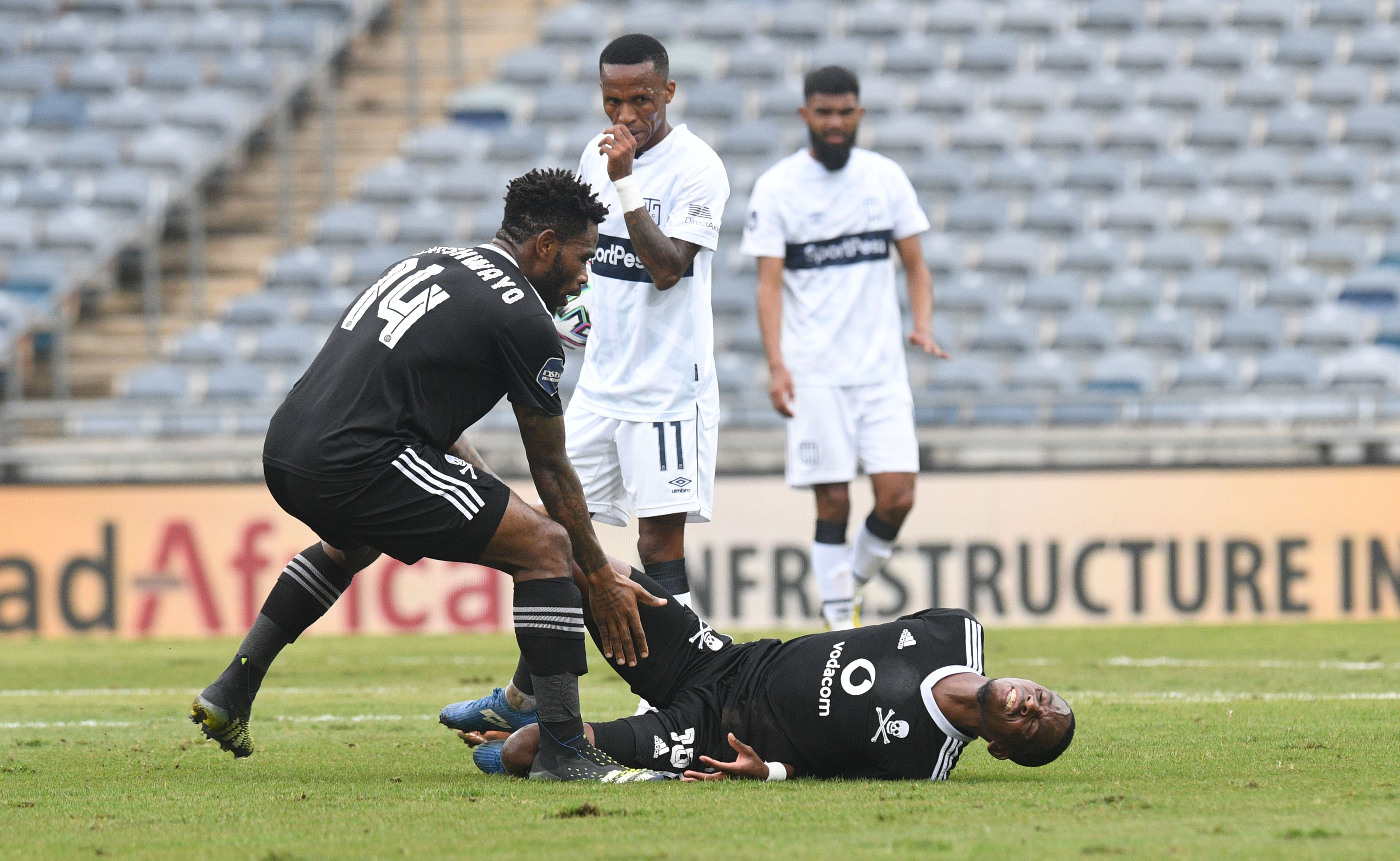 Thabang Monare collapses after a clash of heads with teammates Siphesihle Ndlovu