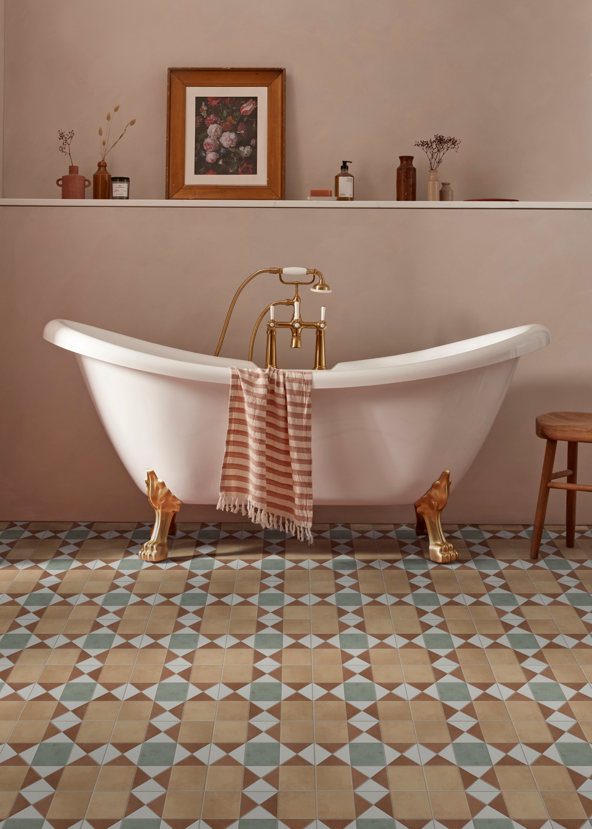 a classic bathroom with a freestanding tub and tiled floors