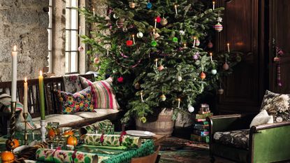 Christmas tree in rustic dining room with colorful scheme