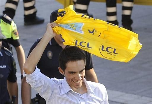 Tour champion Alberto Contador shows off his yellow jersey to residents of his home town of Pinto, Spain on Monday.