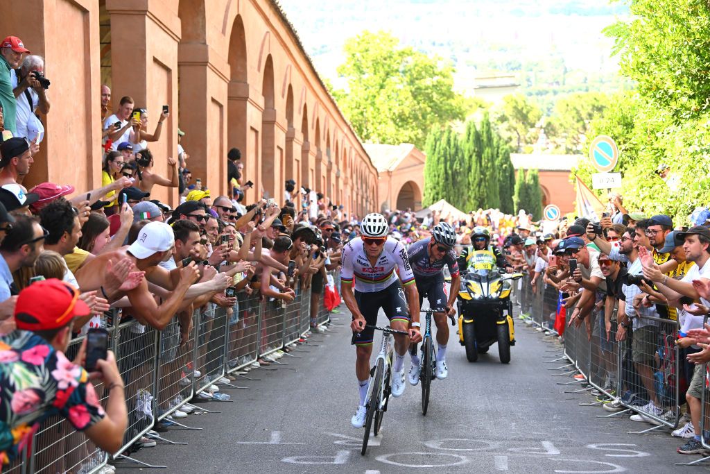 BOLOGNA ITALY JUNE 30 LR Mathieu van der Poel of Netherlands and Silvan Dillier of Switzerland and Team Alpecin Deceuninck while fans cheers during the 111th Tour de France 2024 Stage 2 a 1992km stage from Cesenatico to Bologna UCIWT on June 30 2024 in Bologna Italy Photo by Dario BelingheriGetty Images