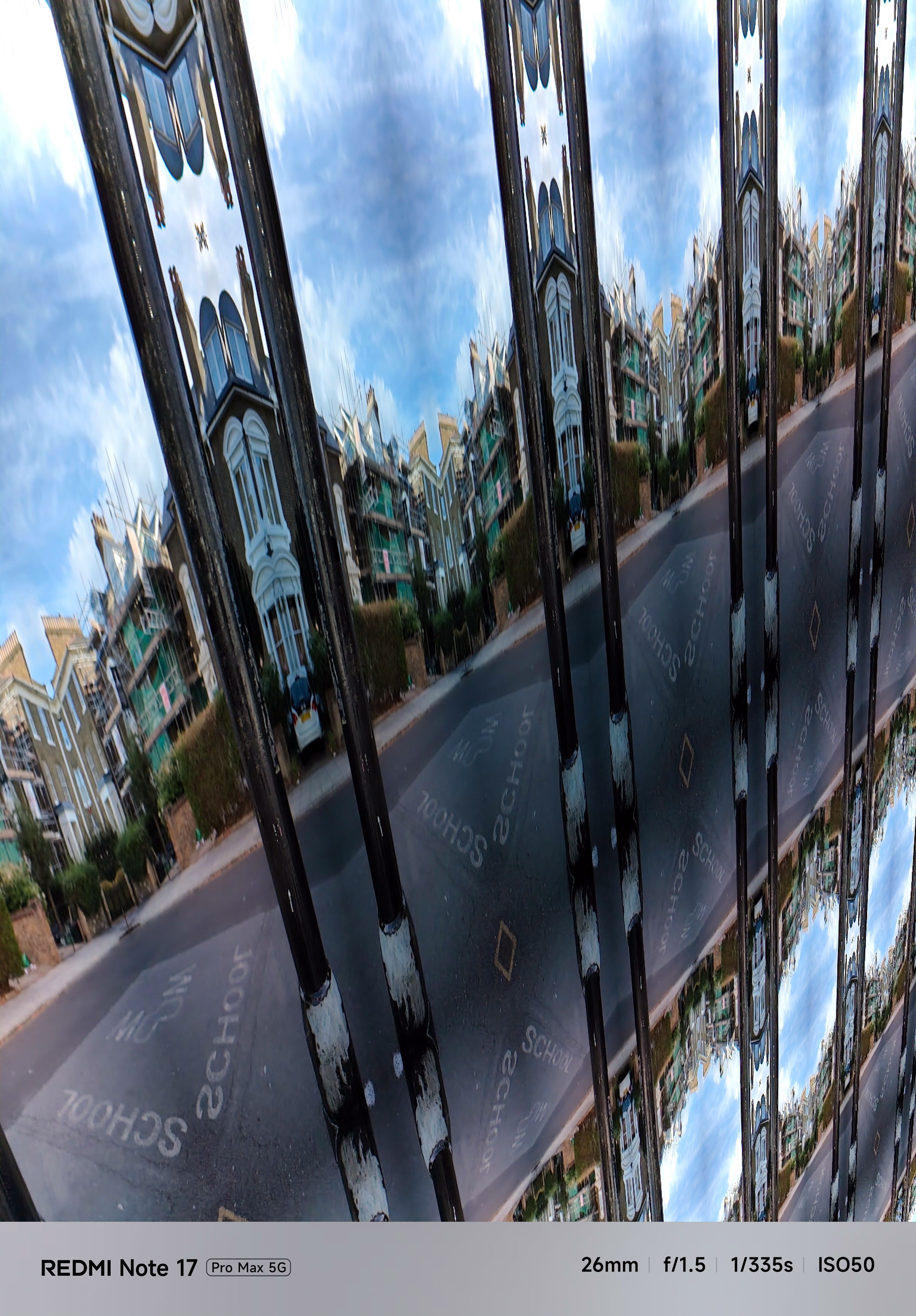 Heavily distorted, kaleidoscopic image of a residential London street caused by a camera processing error.