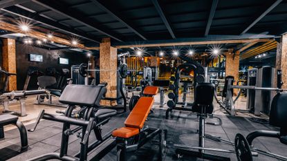 A selection of gym equipment in a lighted studio