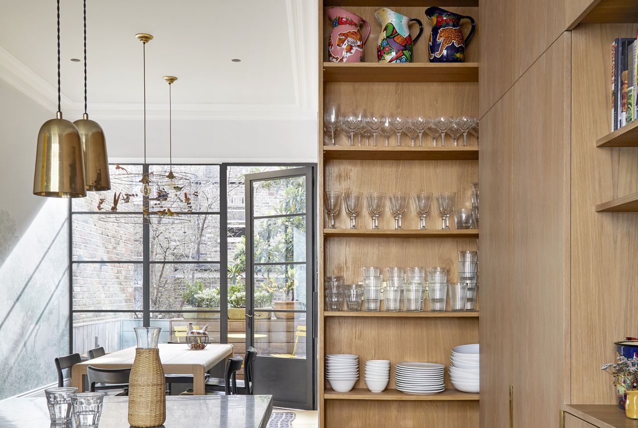 A kitchen with a pull out pantry