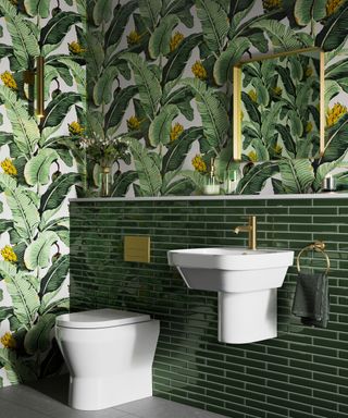 deep green bathroom scheme with jungle wallpaper and green wall tiles