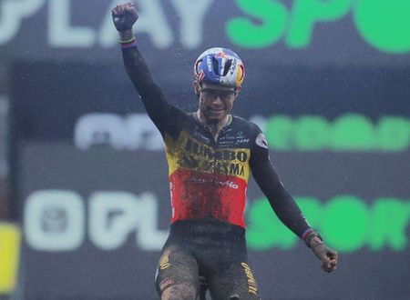 Belgian Wout Van Aert celebrates as he crosses the finish line to win the men elite race of the Superprestige Gullegem, 7th stage (out of 8) in the Superprestige cyclocross cycling competition, in Gullegem, Saturday 07 January 2023. BELGA PHOTO DAVID PINTENS (Photo by David PINTENS / BELGA MAG / Belga via AFP) (Photo by DAVID PINTENS/BELGA MAG/AFP via Getty Images)