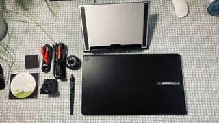 A photo of the Huion Kamvas 16 (2021) drawing tablet on a table