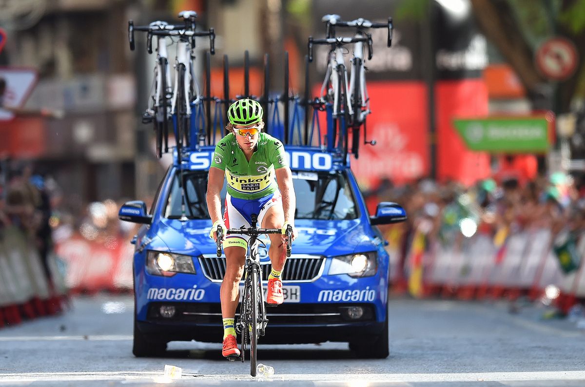 Peter Sagan crosses the line on stage 8 having been knocked off his bike by a race moto
