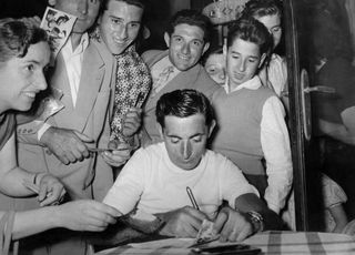Fausto Coppi signs autographs at the 1953 Tre Valli Varesine.