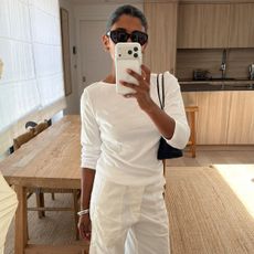 Woman in a white top and pants