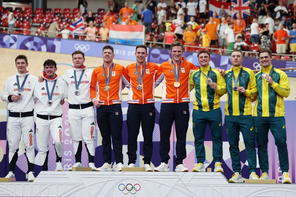PARIS FRANCE AUGUST 06 Silver medalists Ed Lowe Hamish Turnbull Jack Carlin of Team Great Britain Gold medalists Jeffrey Hoogland Harrie Lavreysen Roy van den Berg of Team Netherlands Bronze medalists Matthew Glaetzer Leigh Hoffman Matthew Richardson of Team Australia pose on the podium after the Mens Team Sprint Finals on day eleven of the Olympic Games Paris 2024 at SaintQuentinenYvelines Velodrome on August 06 2024 in Paris France Photo by Tim de WaeleGetty Images