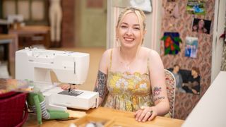 Mia in a strappy yellow top for The Great British Sewing Bee 2023