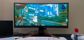 BenQ Mobiuz EX3415R on a gaming desk