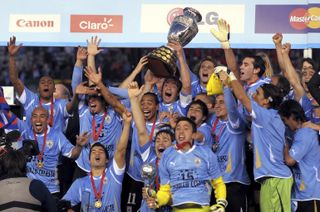 Uruguay players celebrate after winning the Copa America in 2011.
