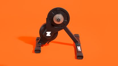 Zwift Hub turbo trainer on an orange background