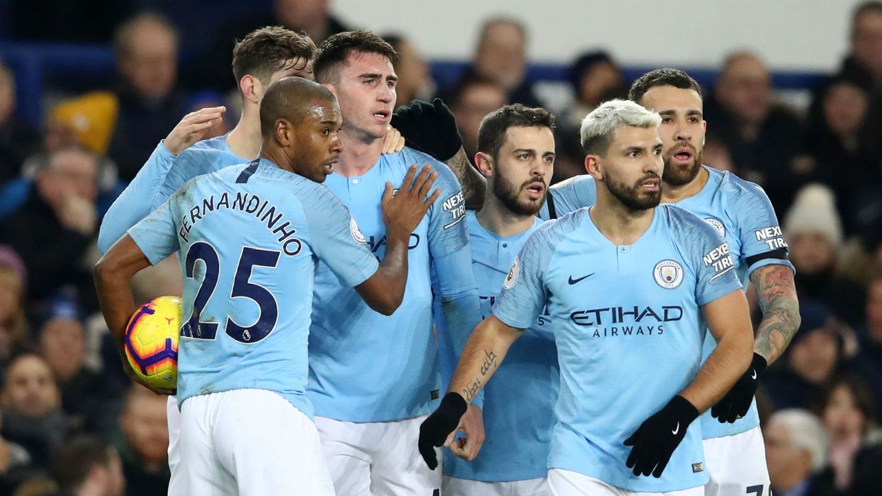 Manchester City players celebrate Aymeric Laporte’s opener against Everton