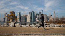 NEW YORK, NY - FEBRUARY 8: A jogger runs along the Brooklyn Bridge Park, February 8, 2017 in the Brooklyn borough of New York City. As temperatures touched 60 degrees on Wednesday, the city i