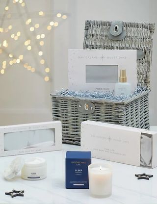 Christmas hamper especially to help sleep with a grey wicker basket