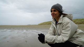 Julia on a windswept Irish beach.