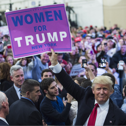 Trump holding poster