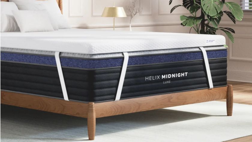 The Helix Premium Memory Foam Mattress Topper with GlacioTex on top of the Helix Midnight Luxe mattress in a clean, light bedroom.
