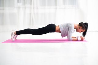 A woman in the plank position