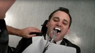 Bill Murray shouts excitedly in front of a scary dental implement in Little Shop Of Horrors.