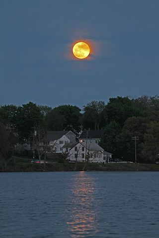 Supermoon of 2012 as seen by photographers Imelda Joson and Edwin Aguirre from Woburn, Mass., on May 5, 2012.
