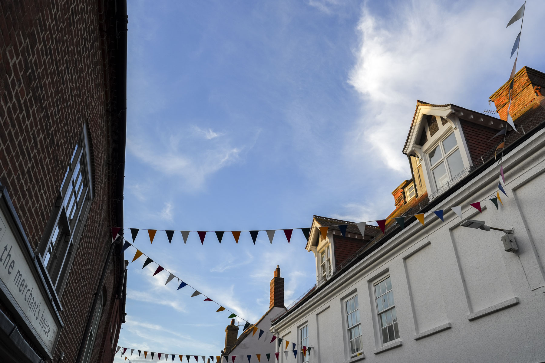 Bunting across old buildings at golden hour captured with the Sony A7C II full-frame mirrorless camera