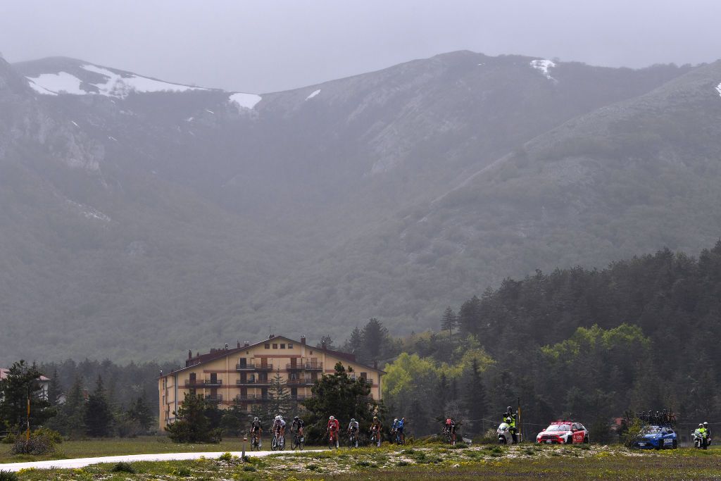 CAMPO FELICE ROCCA DI CAMBIO ITALY MAY 16 George Bennett of New Zealand and Team Jumbo Visma Tony Gallopin of France and AG2R Citren Team Bauke Mollema of Netherlands and Team Trek Segafredo Michael Storer of Australia and Team DSM Nicolas Edet of France and Team Cofidis Koen Bouwman of Netherlands and Team Jumbo Visma Matteo Fabbro of Italy and Team Bora Hansgrohe Einer Augusto Rubio Reyes of Colombia and Movistar Team in the Breakaway passing through Avio 140m during the 104th Giro dItalia 2021 Stage 9 a 158km stage from Castel di Sangro to Campo Felice Rocca di Cambio 1665m Landscape Mountains Snow girodiitalia Giro UCIworldtour on May 16 2021 in Campo Felice Rocca di Cambio Italy Photo by Tim de WaeleGetty Images