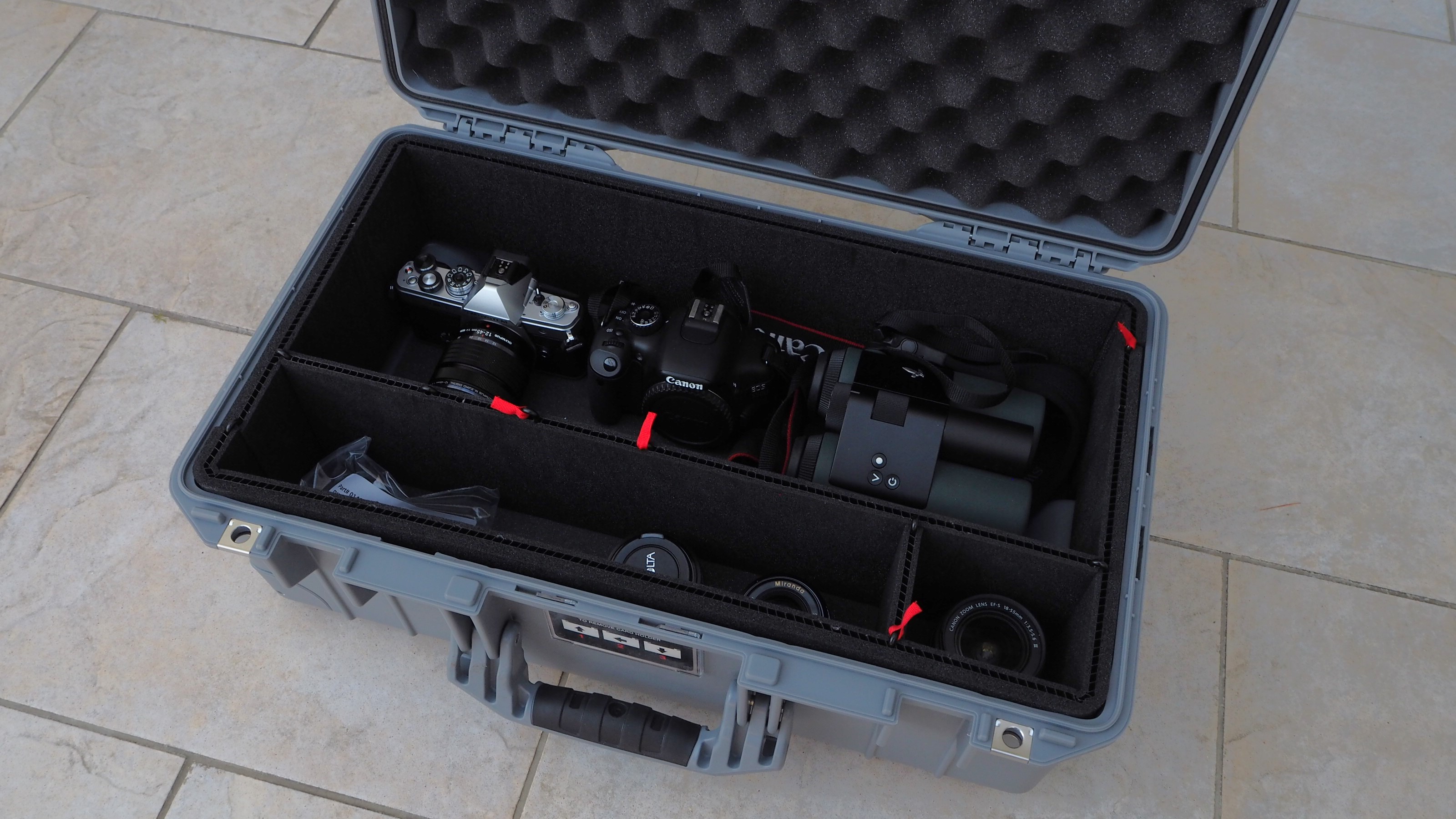 Peli 1535 Air case in grey on a flagstone floor