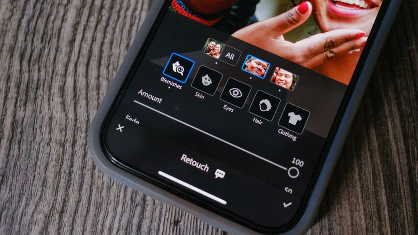 A photo of an iPhone with the Lightroom Mobile blemish slider on the screen