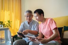 Grandfather and grandson discuss finances.