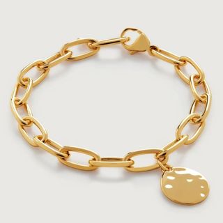 flat lay image of gold bracelet 