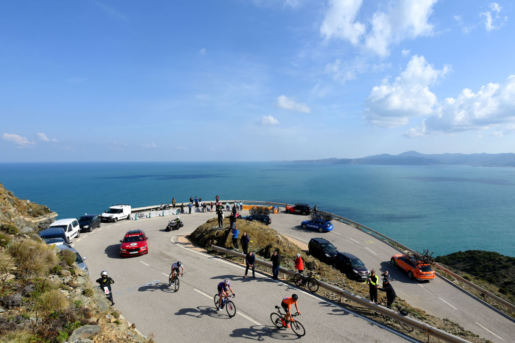 PERPIGNAN FRANCE  MARCH 22 A general view of Jonas Iversby Hvideberg of Norway and Team DSM red mountain jersey Adria Moreno of Spain of Spain and Team Burgos  BH and Joan Bou Company of Spain and Team Euskaltel  Euskadi and passing through a sea landscape during the 101st Volta Ciclista a Catalunya 2022  Stage 2 a 2024km stage from LEscala to Perpignan  VoltaCatalunya101  WorldTour  on March 22 2022 in Perpignan France Photo by David RamosGetty Images