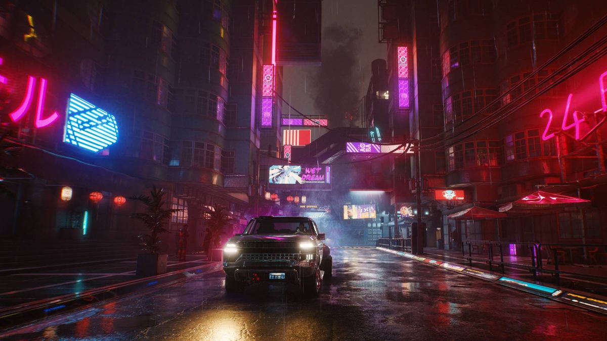 A car facing the camera in the middle of a wet, neon-lit Cyberpunk 2077 street.