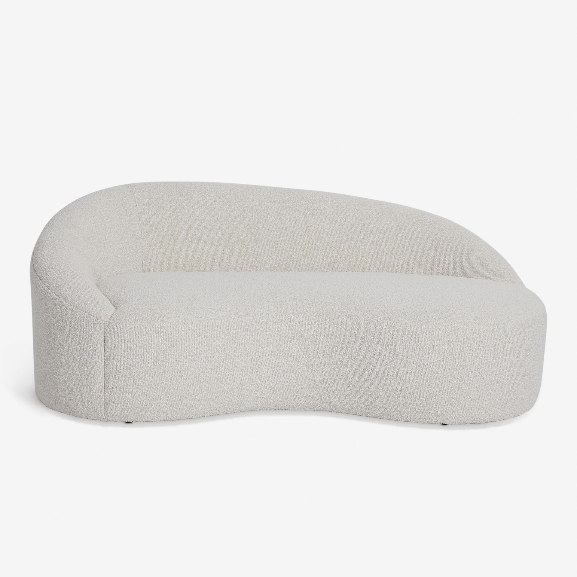 gray curved sofa by Lulu and Georgia