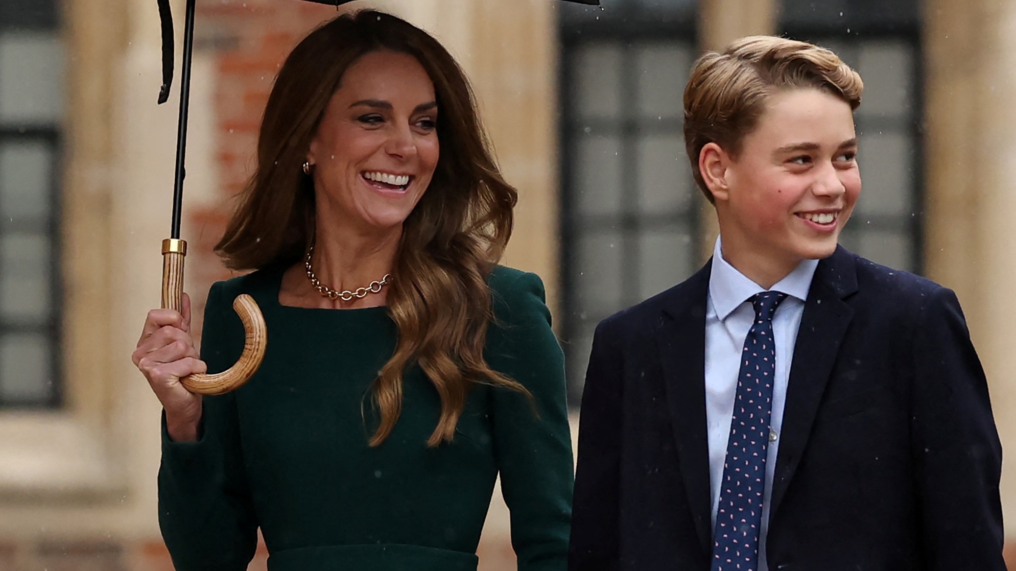 Catherine, Princess of Wales walks, holding an umbrella, with Prince George as he arrives for his first day at Eton College on September 8, 2026