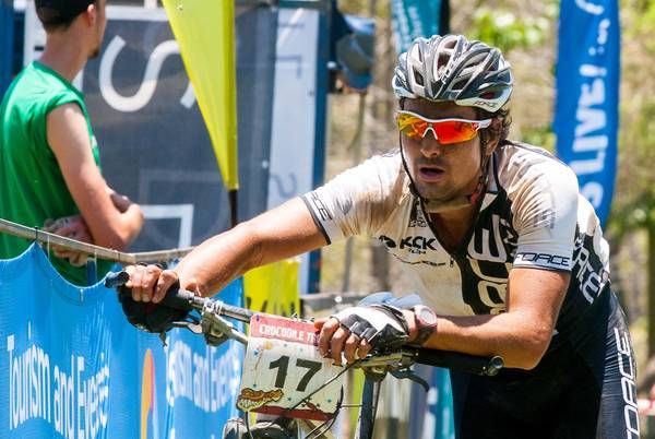 Ondrej Fojtik runs his bike to the line