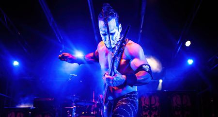 Doyle Wolfgang von Frankenstein in full war pain, performs with his weaponized electric guitar