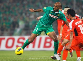 Frederic Kanoute on the ball for Beijing Guoan against Qingdao Jonoon in July 2012.