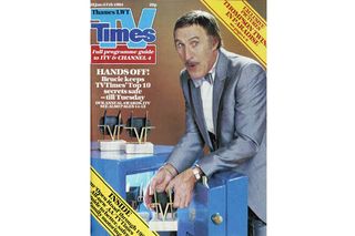 Bruce Forsyth pretends to get the awards out of a safe as he makes the TV Times cover and hosts the annual show in 1984