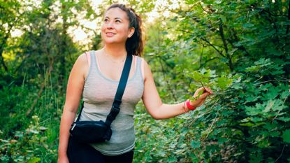 Woman walking in forest