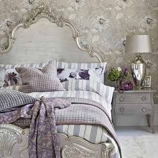 bedroom with sylvia silver luxury king size bed ornate headboard and intricate wallpaper