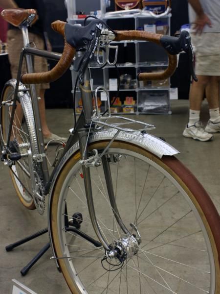The small front rack uses the brake mounting studs as anchor points.